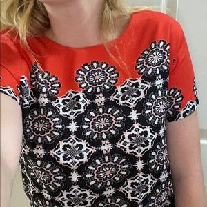 Red and black blouse with flower designs
